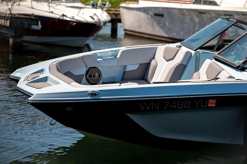  Yacht Photos Pics 2022 MasterCraft XT24 boat with sleek design, docked in marina.