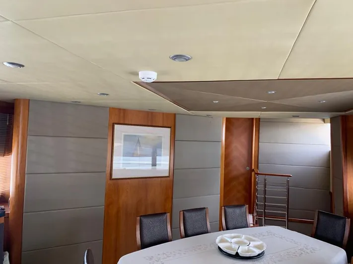 Julcan II Yacht Photos Pics Luxurious interior of 2006 Sunseeker 90 Yacht with elegant dining area and modern decor.