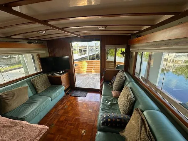 Tortuga Yacht Photos Pics Interior of 1987 Kadey-Krogen 42 yacht with cozy seating and large windows.