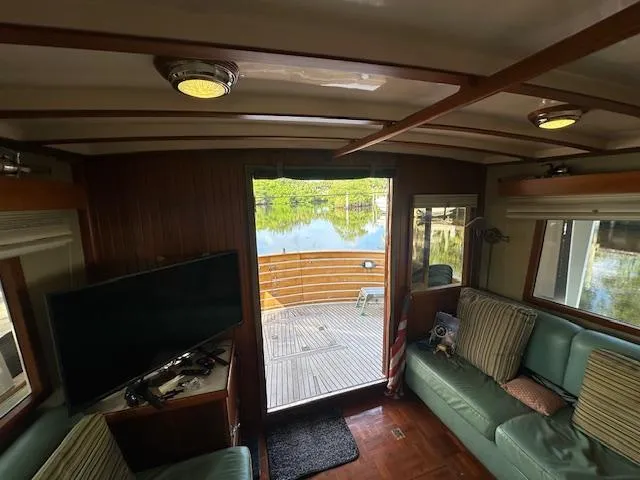 Tortuga Yacht Photos Pics Interior of 1987 Kadey-Krogen 42 yacht with cozy seating and scenic water view.