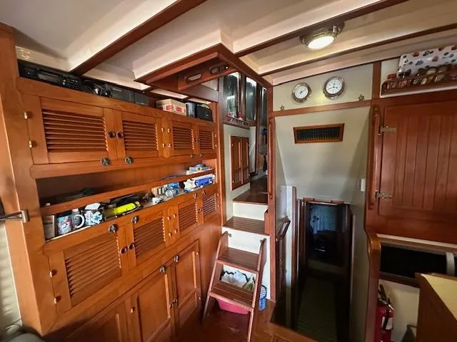 Tortuga Yacht Photos Pics Interior of 1987 Kadey-Krogen 42 boat with wooden cabinets and stairs.