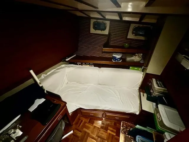 Tortuga Yacht Photos Pics Cozy interior of 1987 Kadey-Krogen 42 yacht with white sofa and wooden accents.
