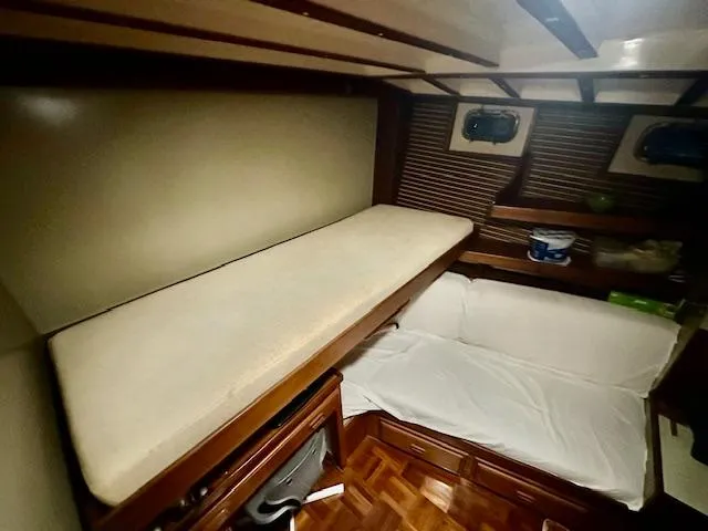 Tortuga Yacht Photos Pics Cozy cabin interior of 1987 Kadey-Krogen 42 yacht with wooden accents and seating area.