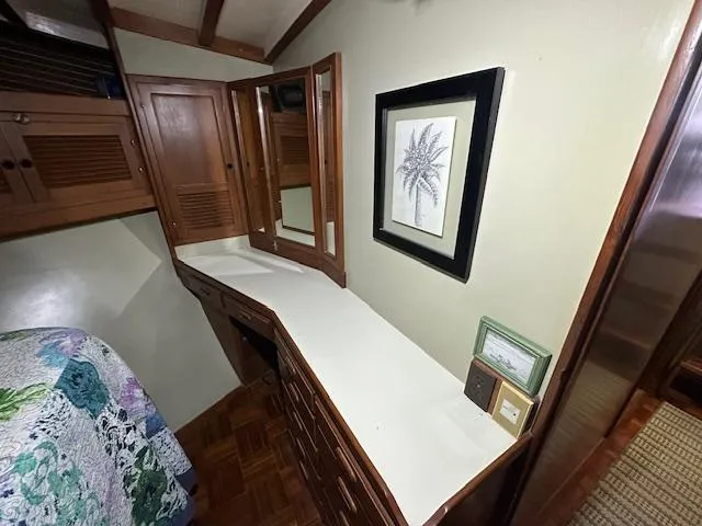 Tortuga Yacht Photos Pics Interior of 1987 Kadey-Krogen 42 yacht with wooden cabinetry and framed artwork.