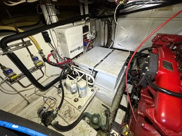 Tortuga Yacht Photos Pics Engine room of a 1987 Kadey-Krogen 42 boat, featuring machinery and wiring.