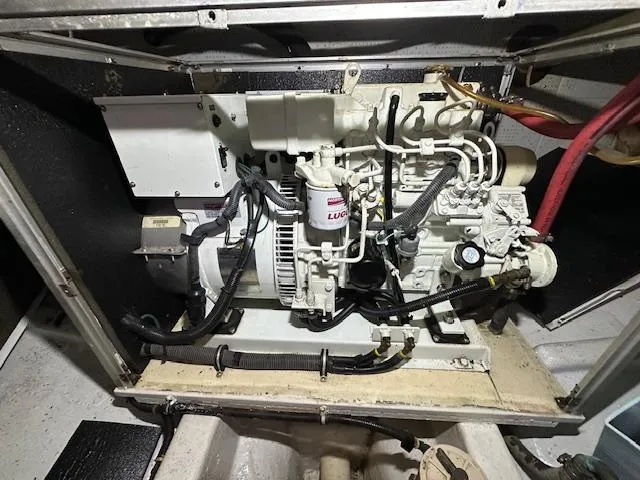 Tortuga Yacht Photos Pics Engine compartment of a 1987 Kadey-Krogen 42 boat, showcasing mechanical components.