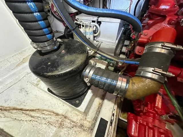 Tortuga Yacht Photos Pics Engine compartment of a 1987 Kadey-Krogen 42 with hoses and mechanical components.