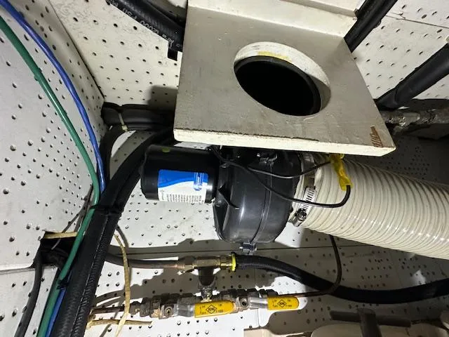 Tortuga Yacht Photos Pics Engine room of a 1987 Kadey-Krogen 42 boat with visible piping and equipment.