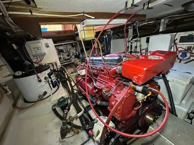 Tortuga Yacht Photos Pics Engine room of a 1987 Kadey-Krogen 42 boat, featuring a red engine.