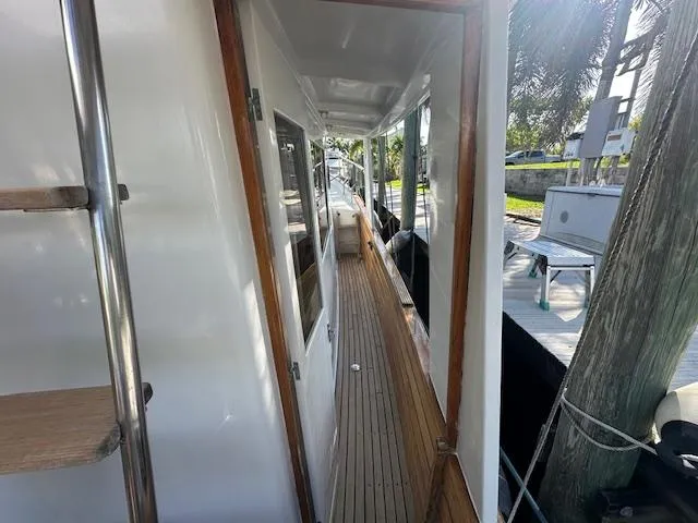 Tortuga Yacht Photos Pics 1987 Kadey-Krogen 42 yacht side deck with wooden flooring and white exterior.