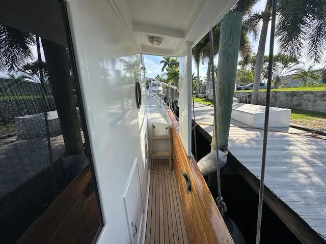 Tortuga Yacht Photos Pics 1987 Kadey-Krogen 42 yacht deck with wooden railings and dockside view.