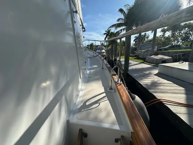 Tortuga Yacht Photos Pics 1987 Kadey-Krogen 42 yacht deck view with palm trees and dock.