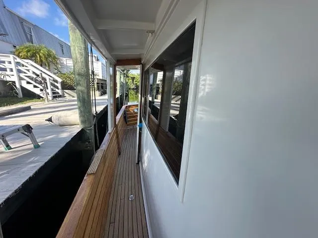 Tortuga Yacht Photos Pics 1987 Kadey-Krogen 42 yacht deck with wooden seating and dock view.