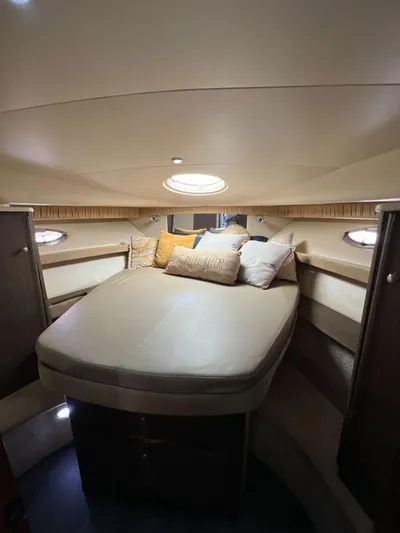  Yacht Photos Pics Luxurious cabin interior of 2004 Meridian 381 yacht with cozy bedding and ambient lighting.