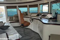 Luxurious interior of 2024 Custom 29m Charter MY yacht with panoramic windows and modern helm.