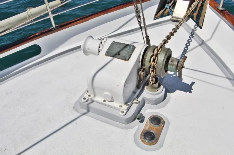 Ocean Villa Yacht Photos Pics Anchor winch on 1991 Custom Centre Cockpit Pilot House Steel Cutter Motorsailer deck.