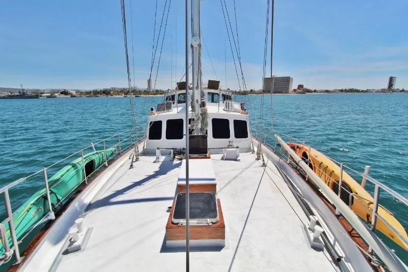 Ocean Villa Yacht Photos Pics Centre cockpit pilot house steel cutter motorsailer on calm blue water, 1991 model.