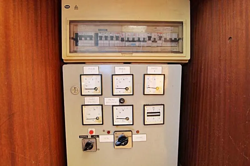 Ocean Villa Yacht Photos Pics Electrical control panel on a 1991 Custom Centre Cockpit Pilot House Steel Cutter Motorsailer.