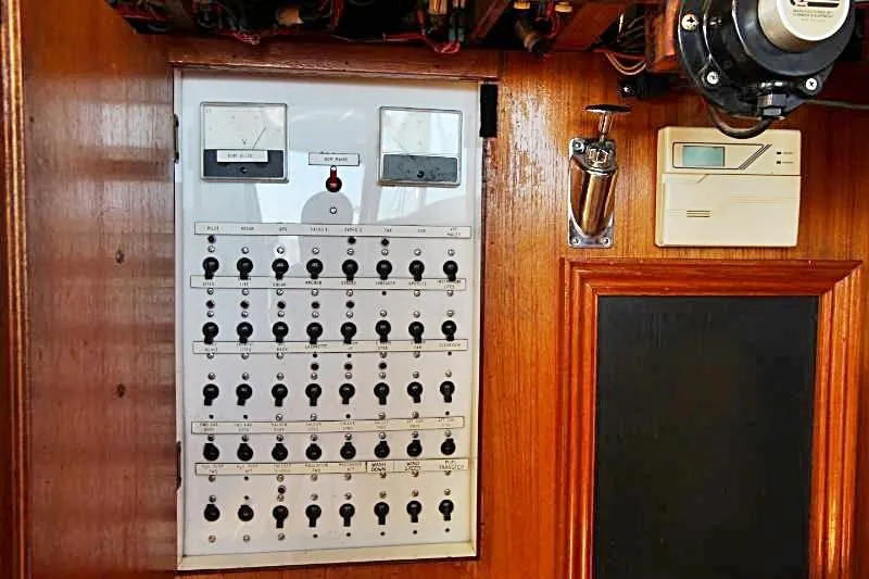 Ocean Villa Yacht Photos Pics Electrical control panel on a 1991 Custom Centre Cockpit Pilot House Steel Cutter Motorsailer.