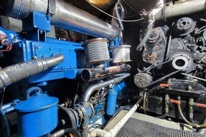 Ocean Villa Yacht Photos Pics Engine room of a 1991 Custom Centre Cockpit Pilot House Steel Cutter Motorsailer.