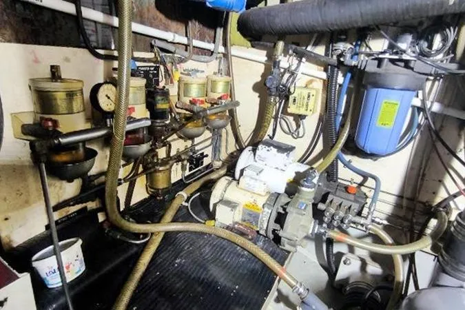 Ocean Villa Yacht Photos Pics Engine room of a 1991 Custom Centre Cockpit Pilot House Steel Cutter Motorsailer.