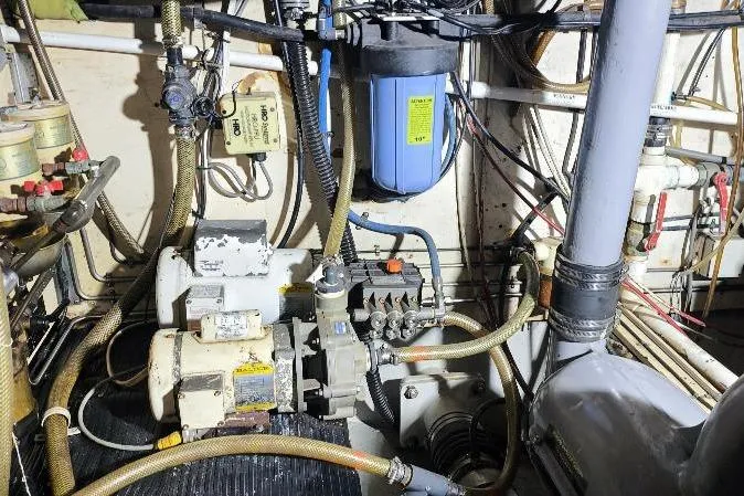 Ocean Villa Yacht Photos Pics Engine room of a 1991 Custom Centre Cockpit Pilot House Steel Cutter Motorsailer.