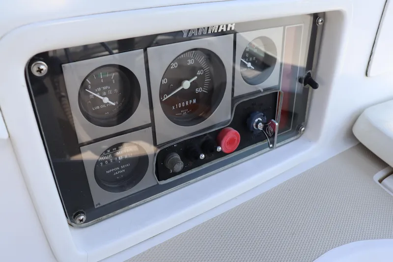 Cianna Yacht Photos Pics Control panel of a 2001 Sabre 402 boat, featuring gauges and switches.