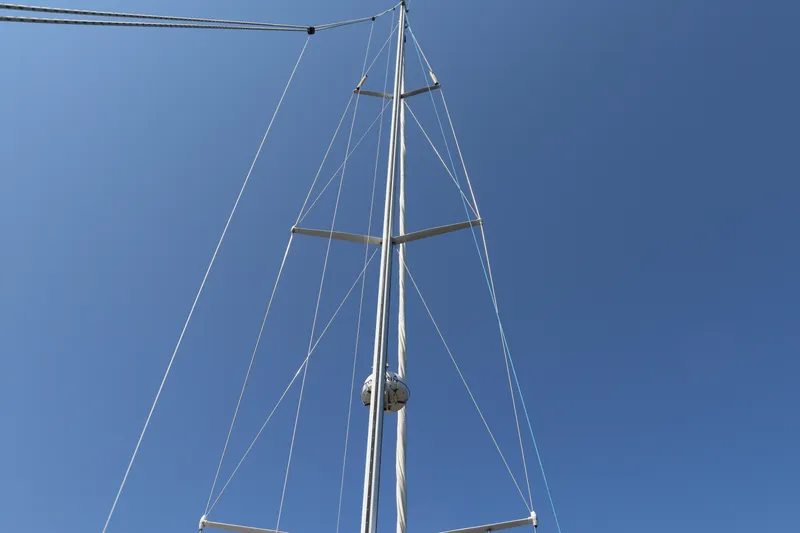 Cianna Yacht Photos Pics Mast of 2001 Sabre 402 sailboat against clear blue sky.