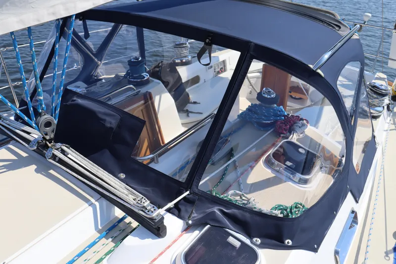 Cianna Yacht Photos Pics 2001 Sabre 402 sailboat cockpit with blue canopy and nautical equipment.