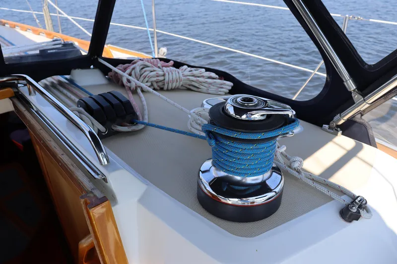 Cianna Yacht Photos Pics Sailboat deck with winch and ropes, Sabre 402, 2001 model, on calm water.