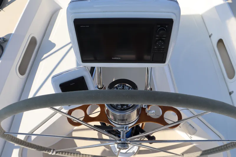 Cianna Yacht Photos Pics Steering wheel and navigation system on a 2001 Sabre 402 sailboat.