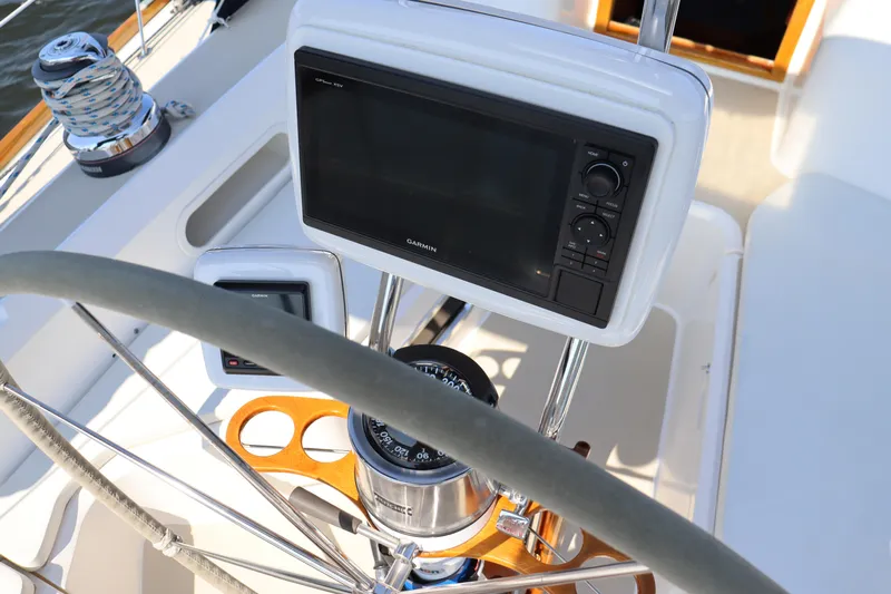 Cianna Yacht Photos Pics Steering wheel and navigation equipment on a 2001 Sabre 402 sailboat.