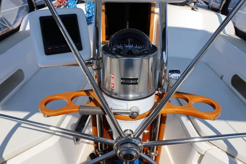 Cianna Yacht Photos Pics Steering wheel and compass on 2001 Sabre 402 sailboat cockpit.