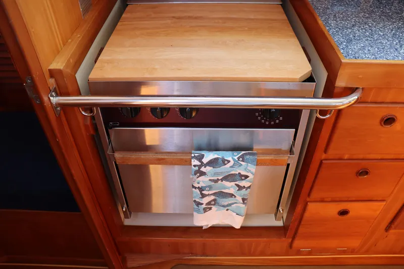 Cianna Yacht Photos Pics Wooden kitchen area with stainless steel oven in 2001 Sabre 402 yacht.