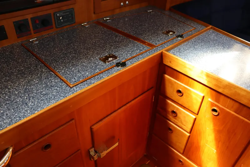 Cianna Yacht Photos Pics Wooden yacht galley with blue countertops, Sabre 402, 2001 model.