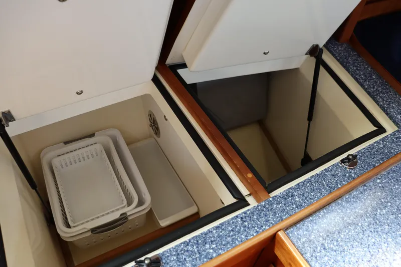 Cianna Yacht Photos Pics Storage compartments in a 2001 Sabre 402 yacht, featuring organized interior space.