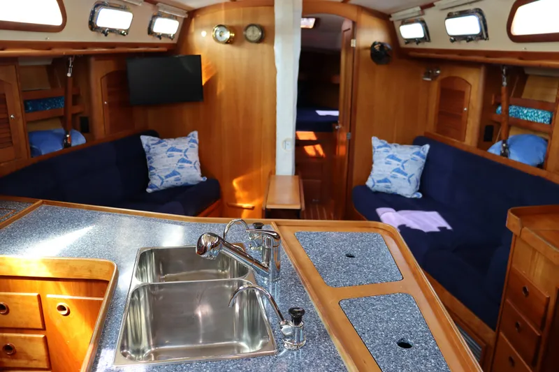 Cianna Yacht Photos Pics Interior of 2001 Sabre 402 sailboat with wooden cabinetry and modern amenities.