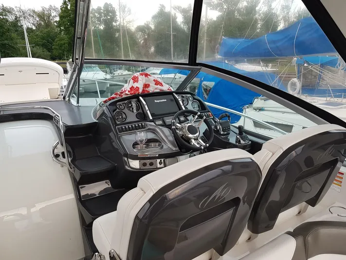  Yacht Photos Pics Cockpit of 2013 Monterey 340 Sport Yacht with modern controls and dual seating.