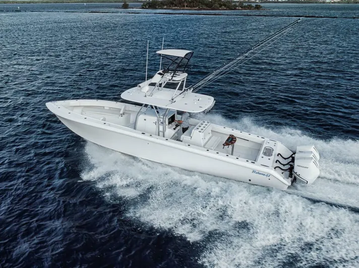 Southpaw Yacht Photos Pics 2015 Bahama 41' boat cruising on open water, showcasing sleek design and powerful engines.
