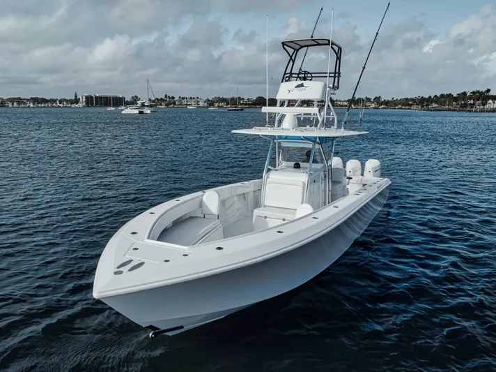 Southpaw Yacht Photos Pics 2015 Bahama 41' boat on calm water, featuring a sleek design and multiple engines.