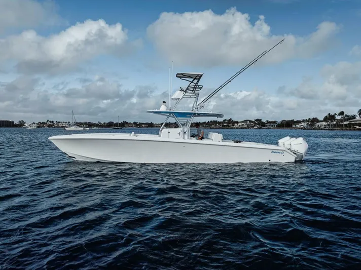 Southpaw Yacht Photos Pics 2015 Bahama 41' boat on open water under cloudy sky.