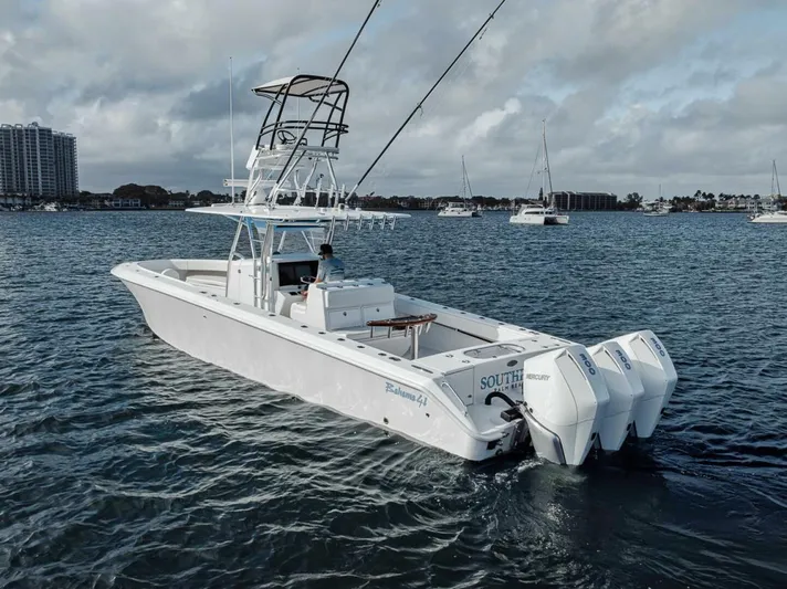 Southpaw Yacht Photos Pics 2015 Bahama 41' boat with triple engines on calm water.