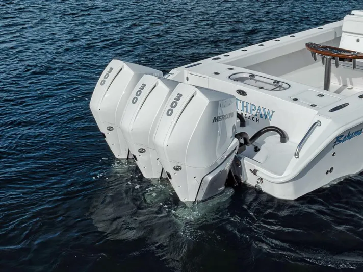 Southpaw Yacht Photos Pics 2015 Bahama 41' boat with triple Mercury outboard engines on water.
