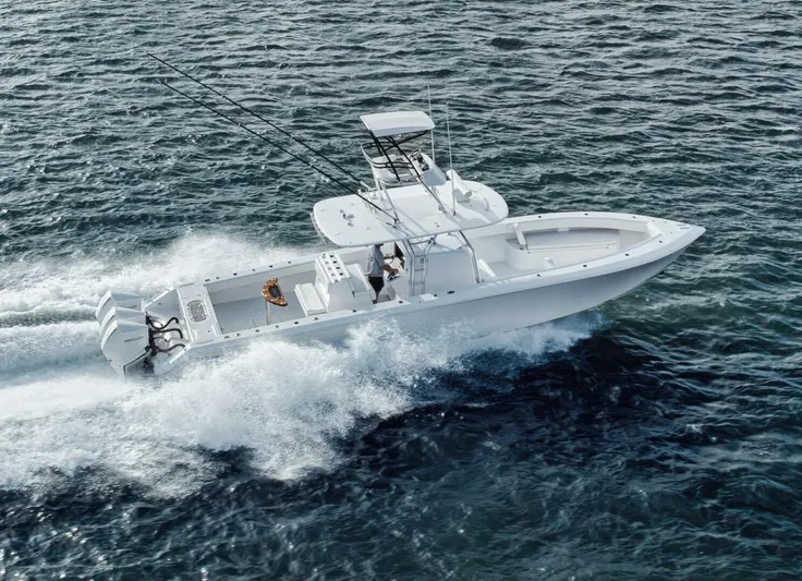 Southpaw Yacht Photos Pics 2015 Bahama 41' boat cruising on open water, showcasing sleek design and powerful engines.