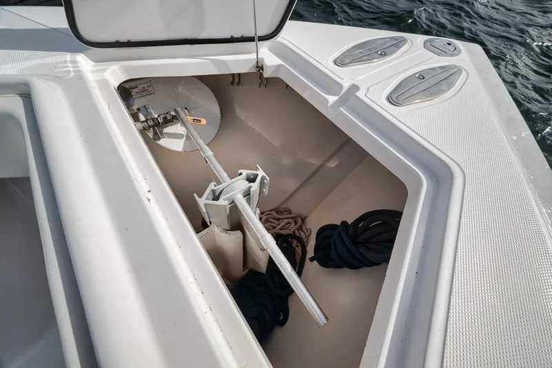 Southpaw Yacht Photos Pics Open anchor compartment on 2015 Bahama 41' boat with ropes and anchor.