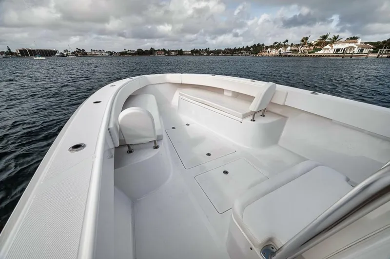 Southpaw Yacht Photos Pics 2015 Bahama 41' boat, spacious deck, calm waters, overcast sky.
