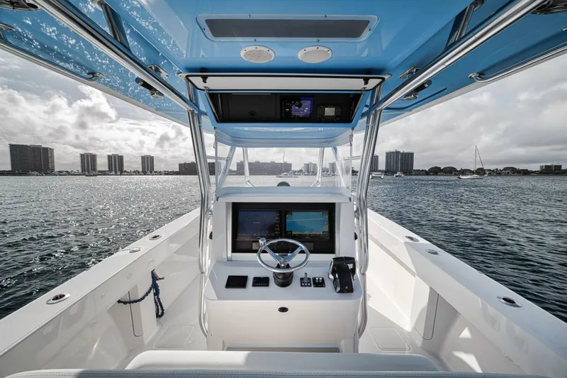 Southpaw Yacht Photos Pics 2015 Bahama 41' boat helm with ocean view and city skyline.
