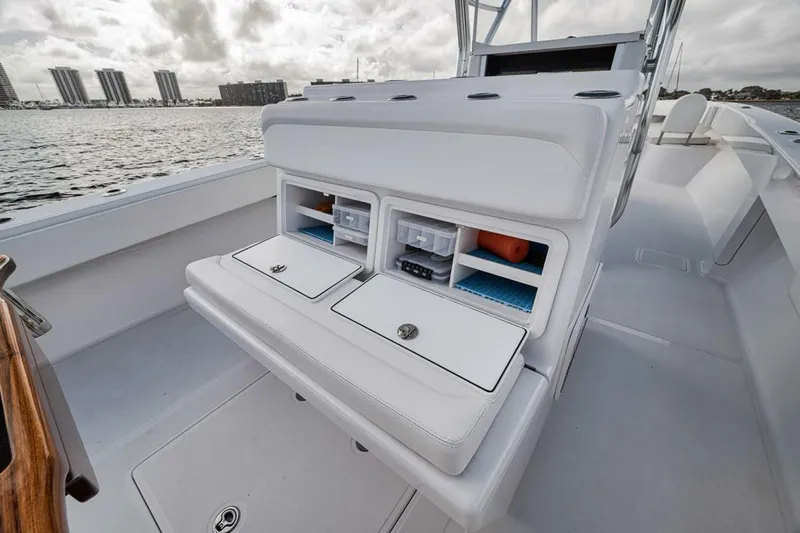 Southpaw Yacht Photos Pics 2015 Bahama 41' boat with storage compartments, docked by the waterfront.