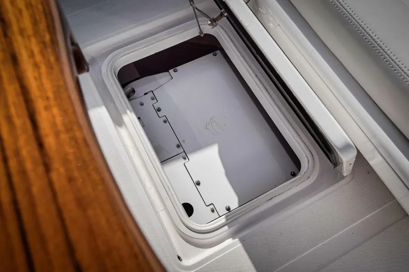 Southpaw Yacht Photos Pics Open hatch on 2015 Bahama 41' boat deck, showcasing storage compartment.