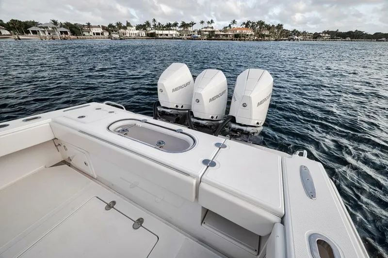 Southpaw Yacht Photos Pics 2015 Bahama 41' boat with triple Mercury engines on the water.